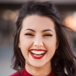 A smiling person. Photo by Michael Dam on Unsplash.