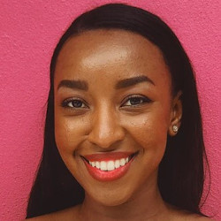 A smiling person. Photo by Juno Jo on Unsplash.